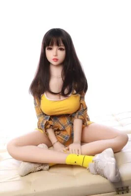 Mini sex doll sitting cross-legged