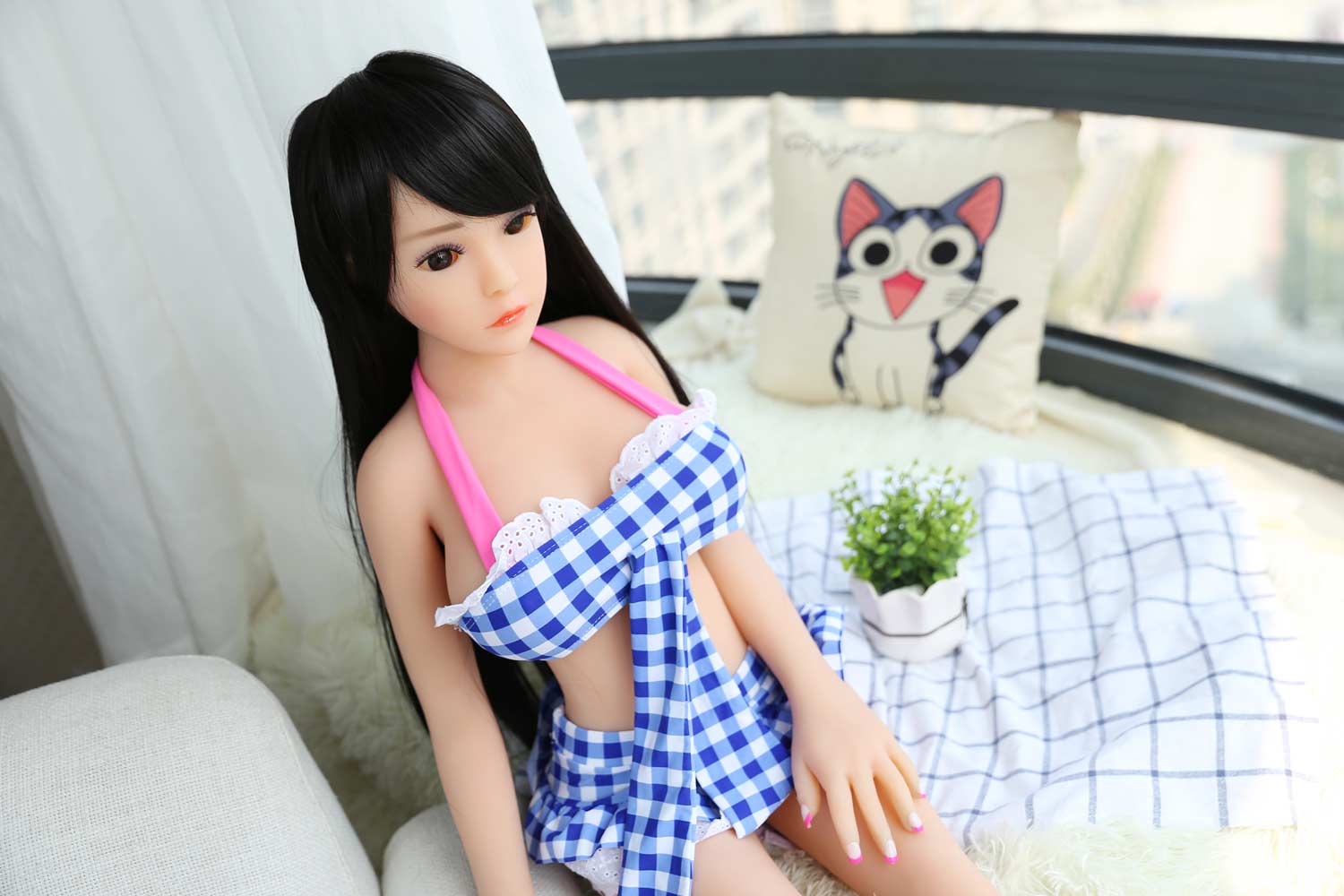 Mini sex doll with hand on thigh