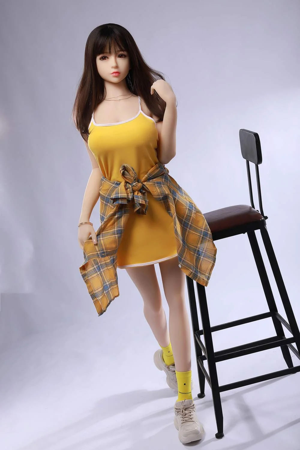 Mini sex doll with shirt tied to waist