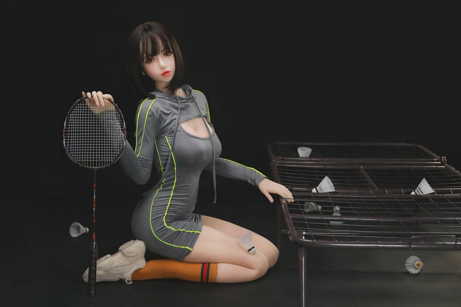 Sex doll holding badminton racket