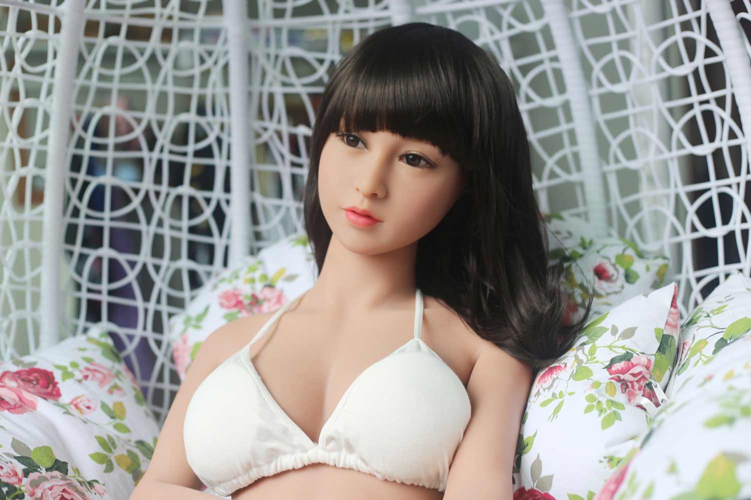 Sex doll lying on pillow