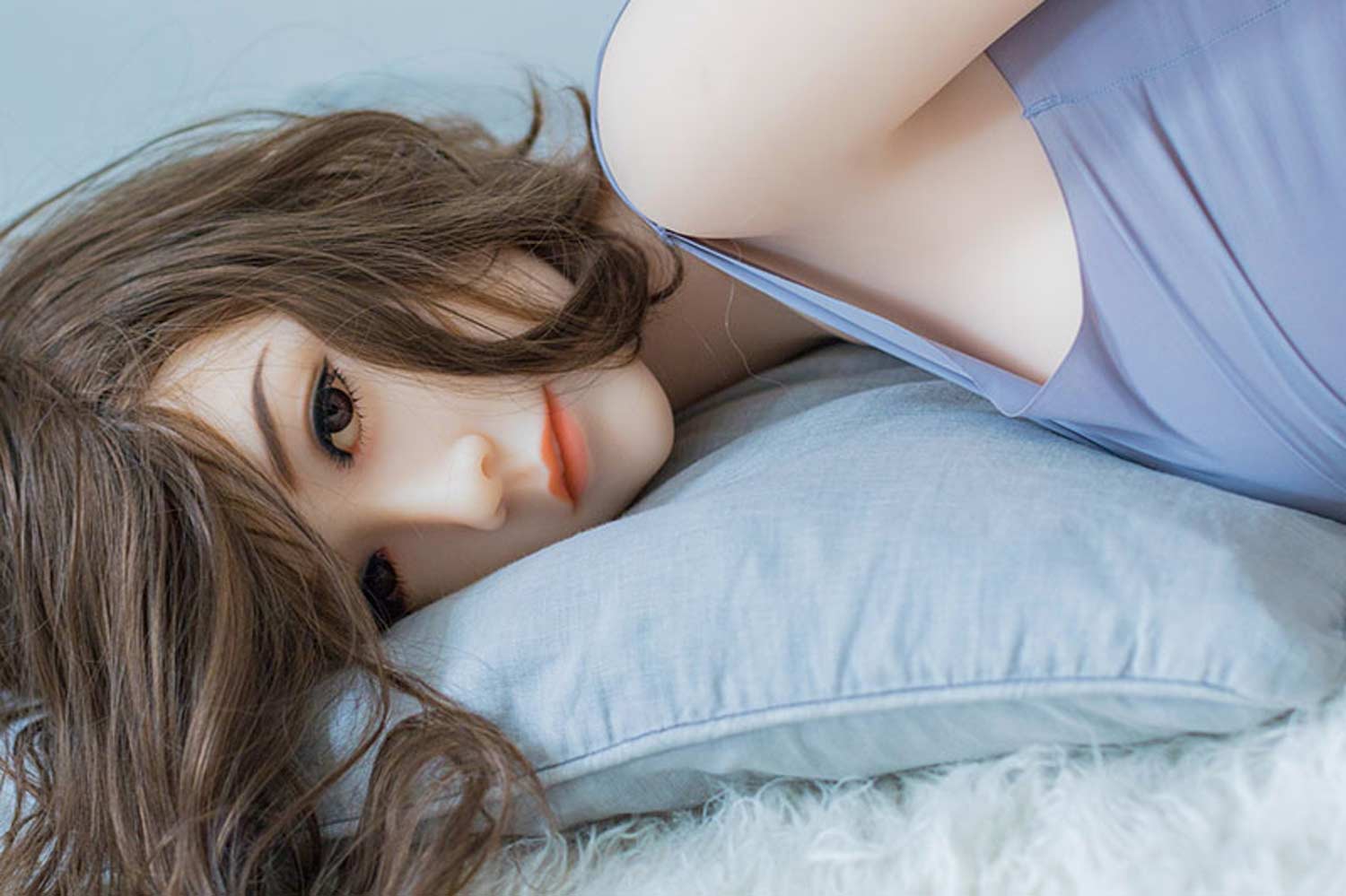Sex doll lying on pillow
