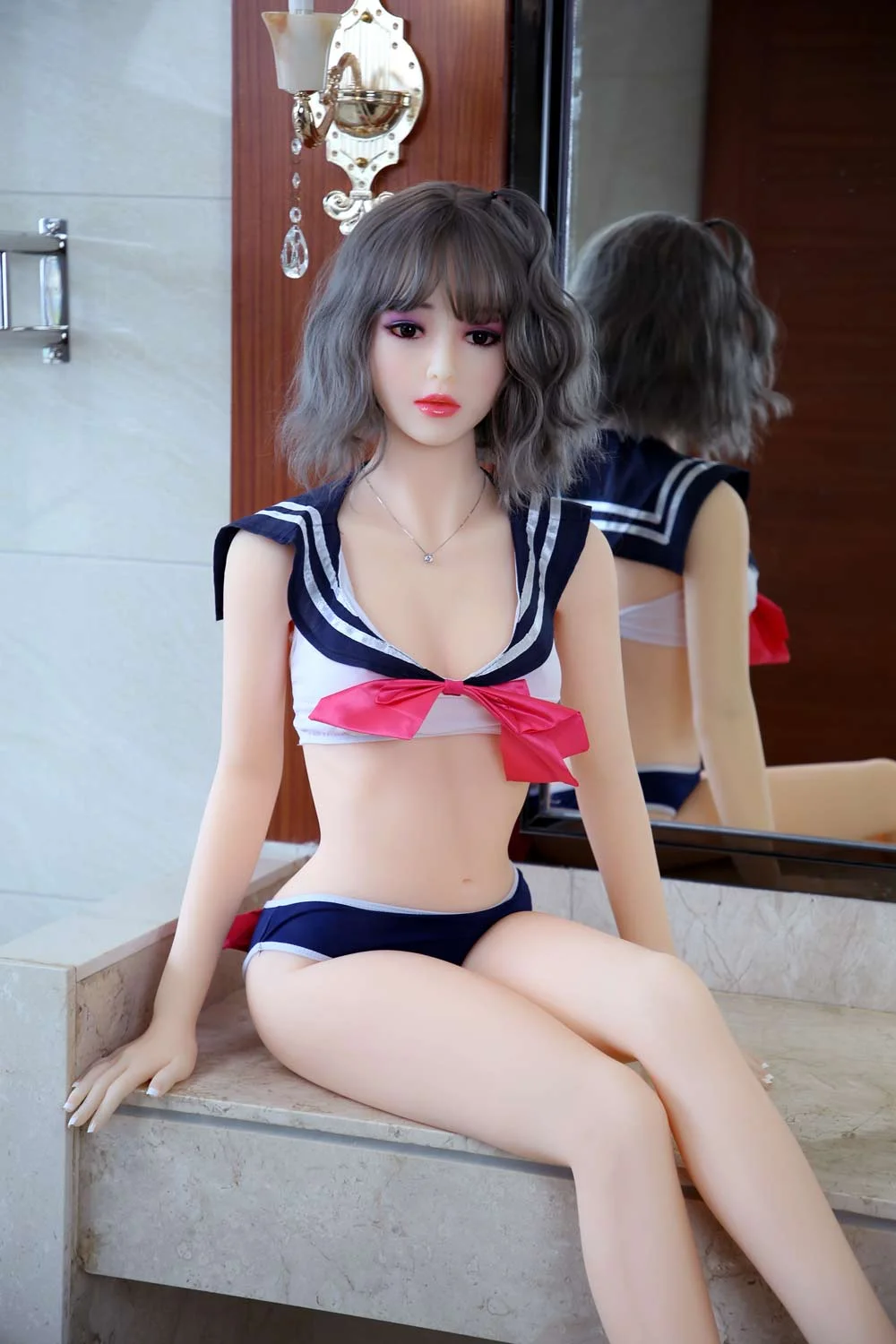 Sex doll sitting on the sink