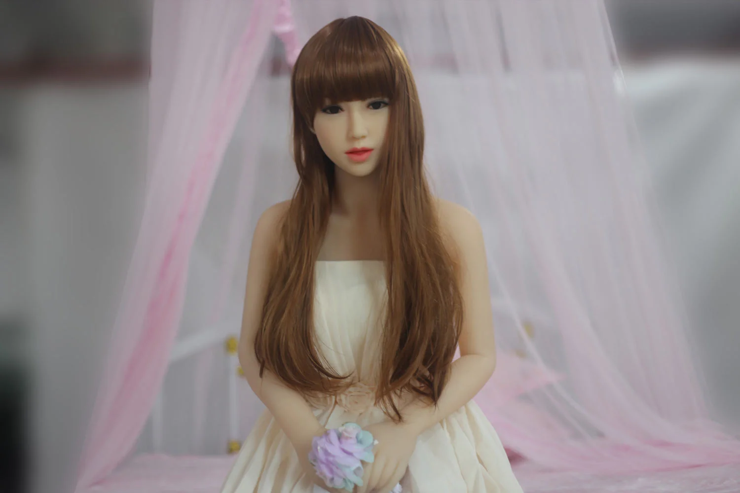 Sex doll with flowers in both hands
