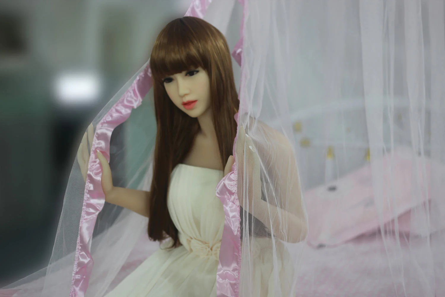 Sex doll with hands holding mosquito net