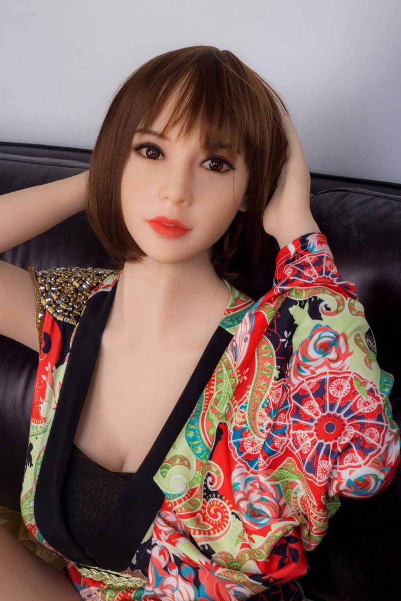 Sex doll with hands on back of head