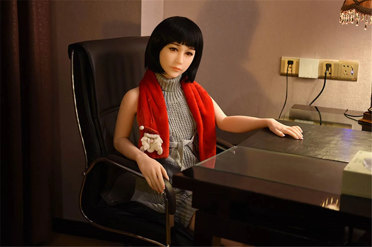 Sex doll with hands on chair armrests