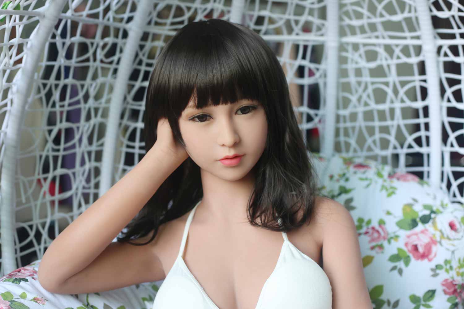 Sex doll with hands on head