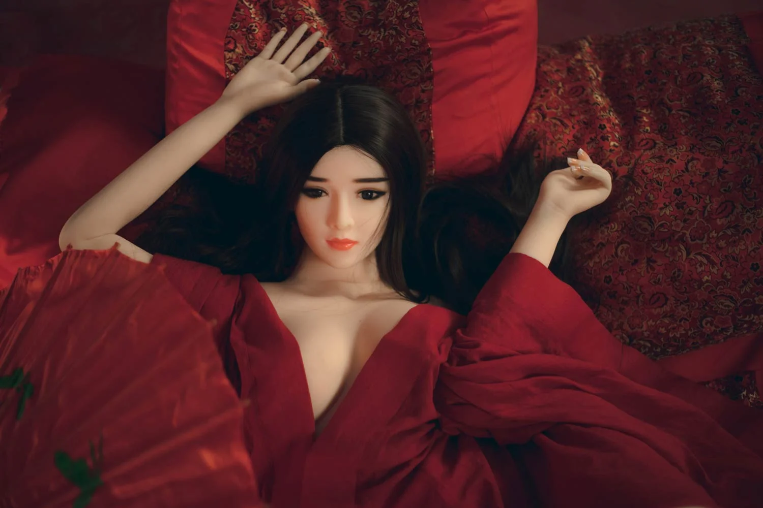 Sex doll with hands on pillows
