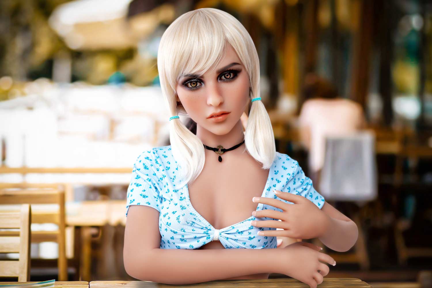 Sex doll with hands on the table