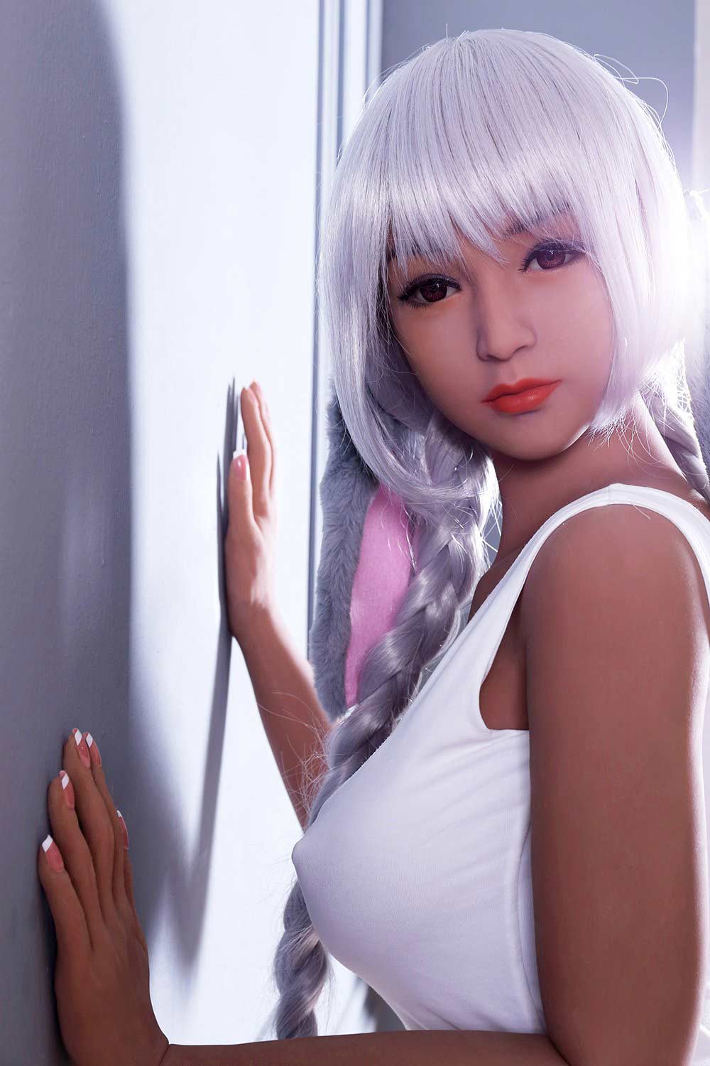 Sex doll with hands on the wall