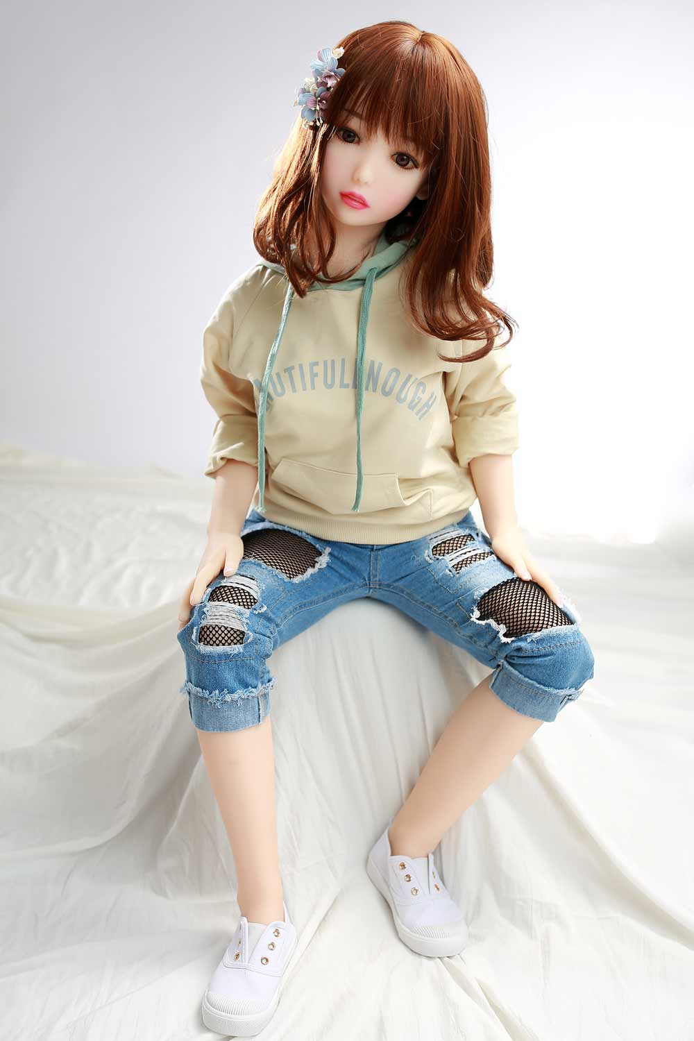 Sex doll with hands on thighs