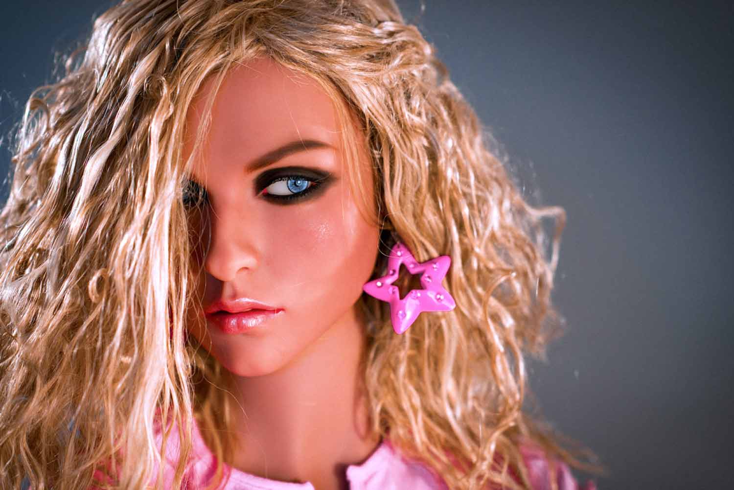 Sex doll with pink star earrings