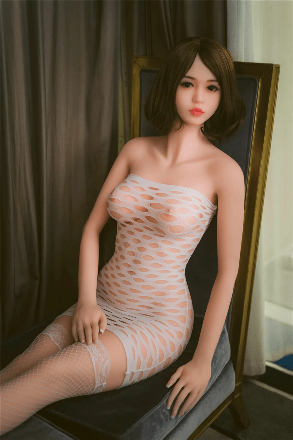 Sexy Sex Doll Sitting In A Chair