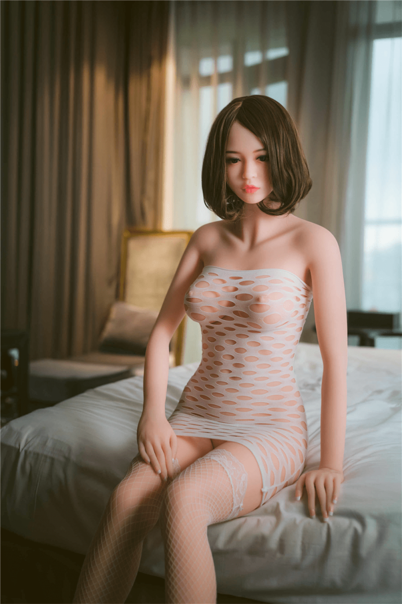 Sex Doll Sitting On The Bed