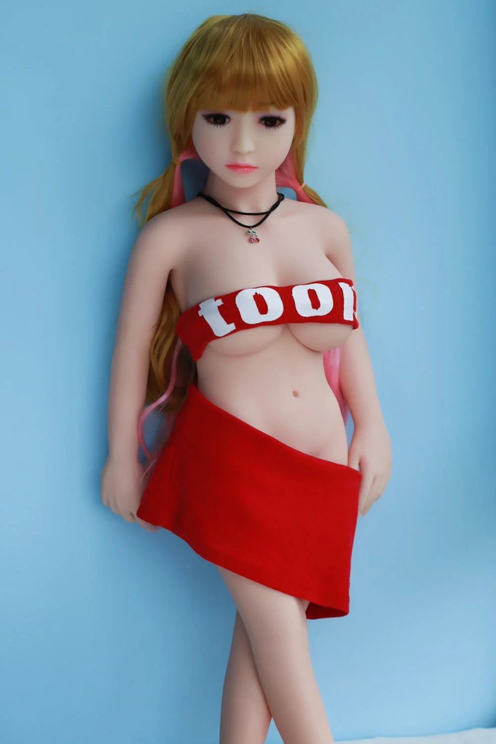 Mini sex doll taking off pants