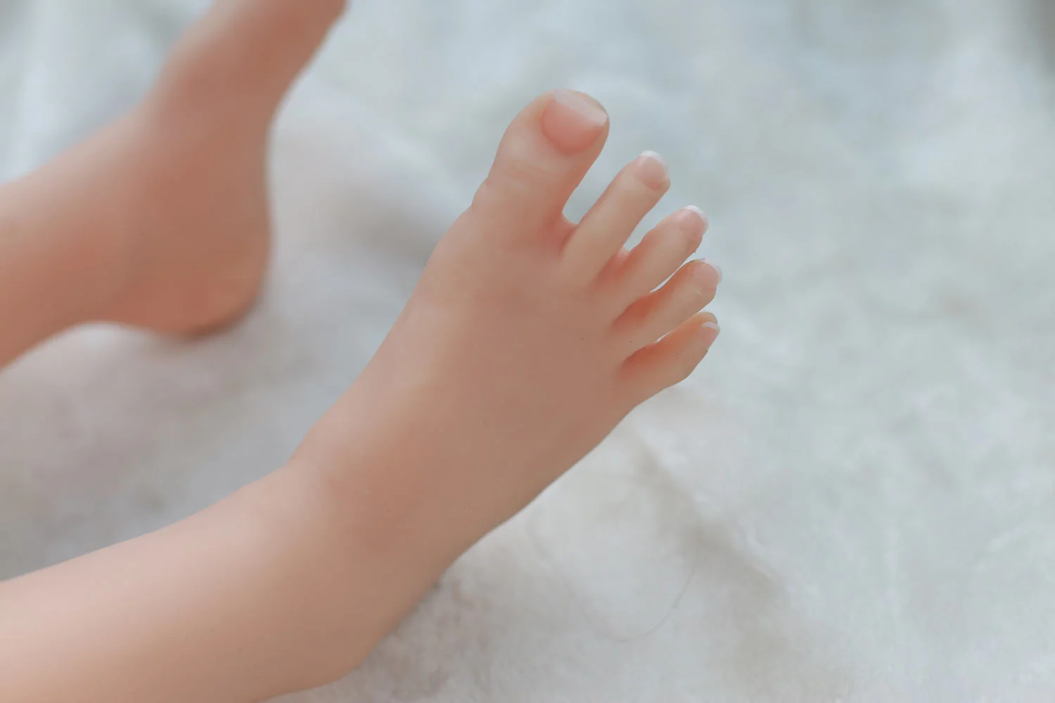 Mini sex doll with long nails