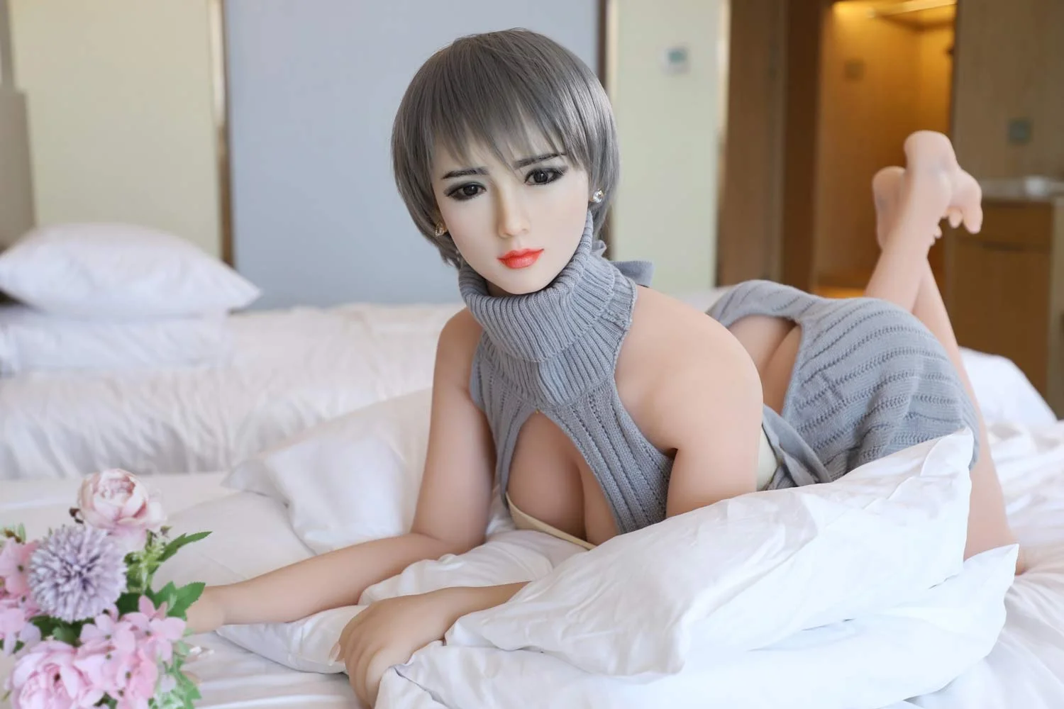 Silicone sex doll lying on the bed