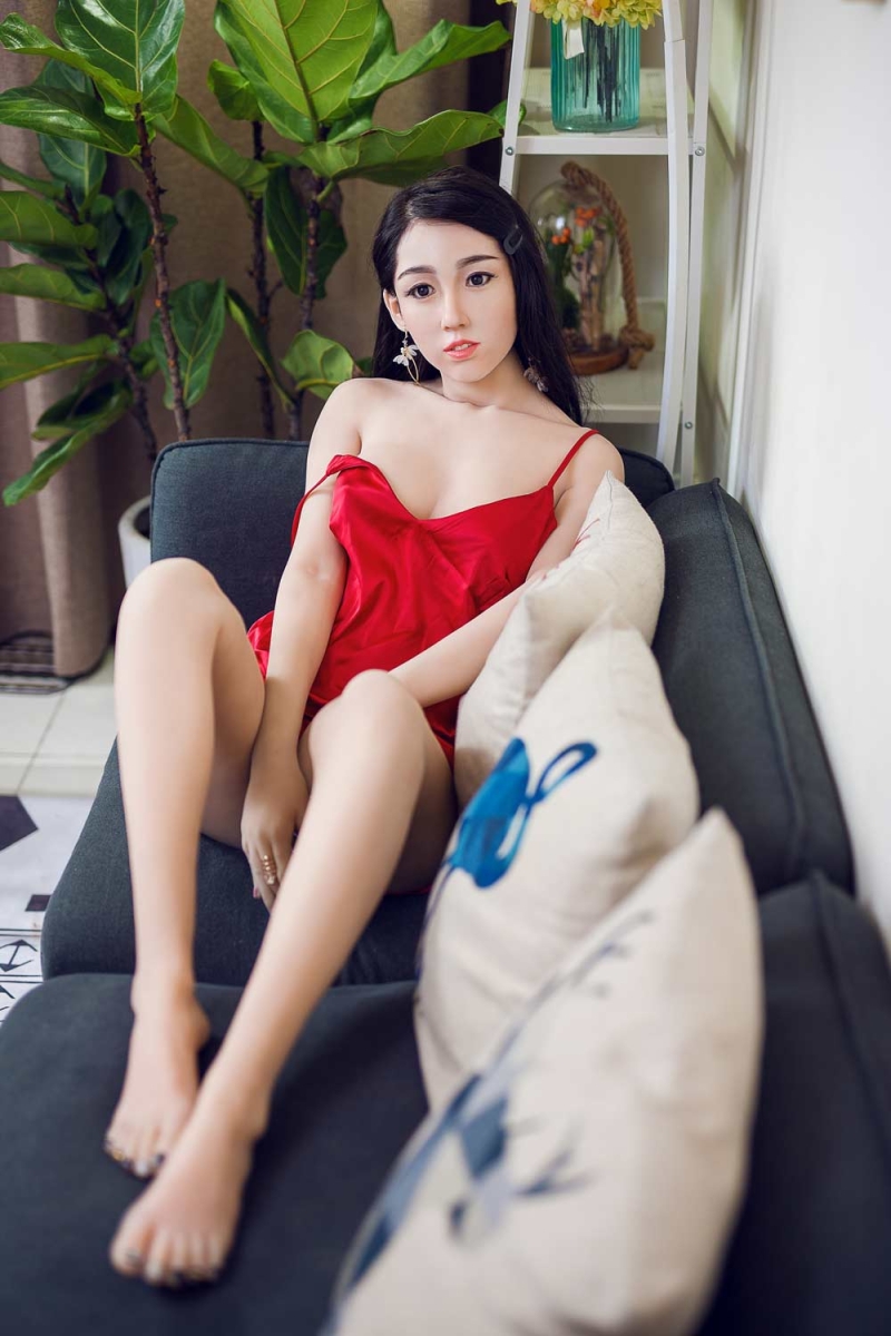 Silicone sex doll with hands between thighs