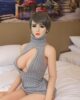 Silicone sex doll with hands on the bed