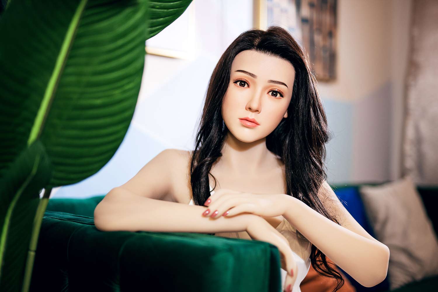 Silicone sex doll with hands on the sofa
