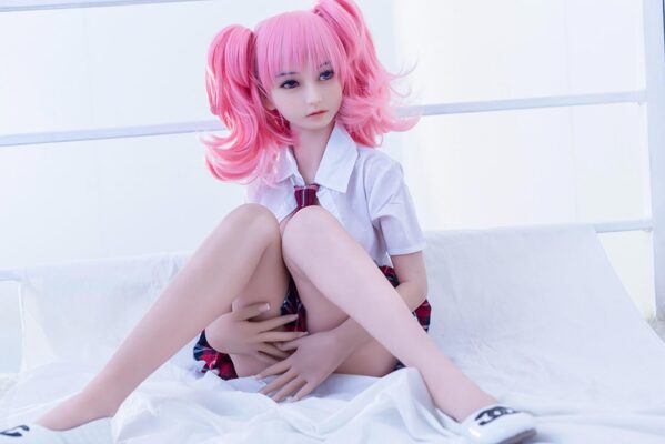 How Long Will My Sex Doll Last A mini sex doll sitting on the ground with her hand covering her skirt