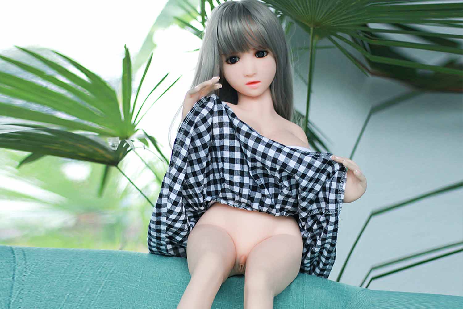 A mini sex doll with a skirt and a vagina