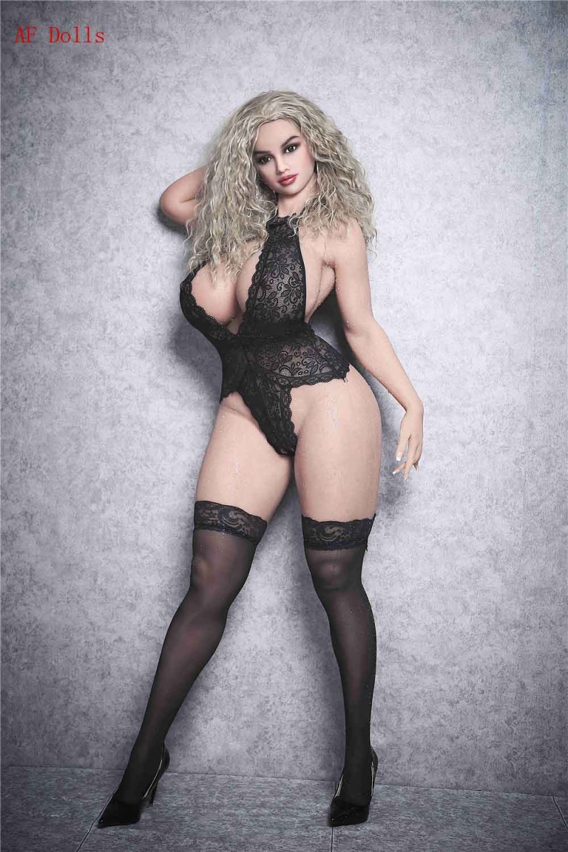Big breasted sex doll in black stockings