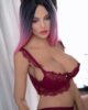 Big breasted sex doll with black and pink hair