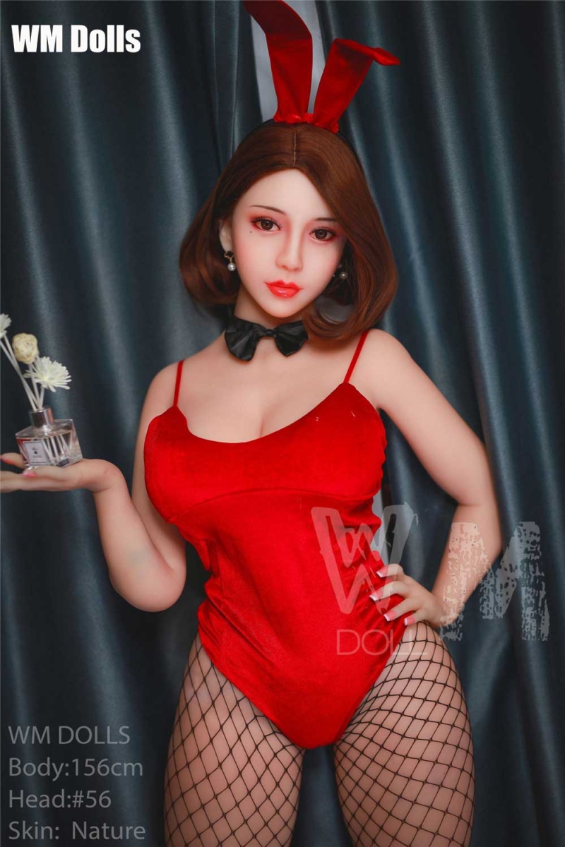 Big breasted sex doll with one hand on hips