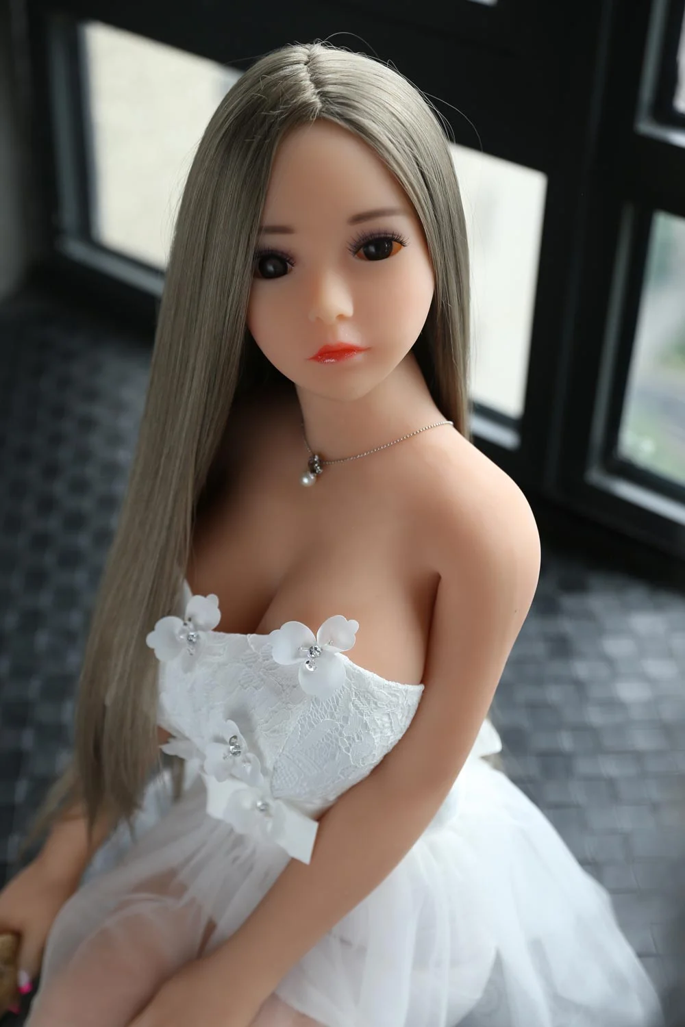 Mini sex doll with big black eyes