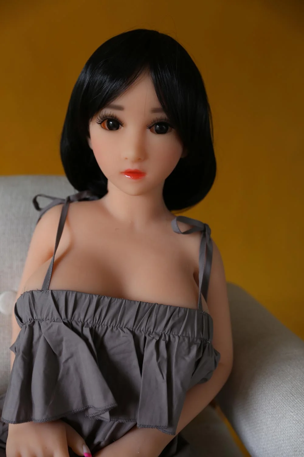Mini sex doll with black hair and big eyes