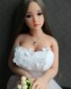 Mini sex doll with flowers in both hands