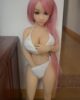 Mini sex doll with hands touching breasts and vagina
