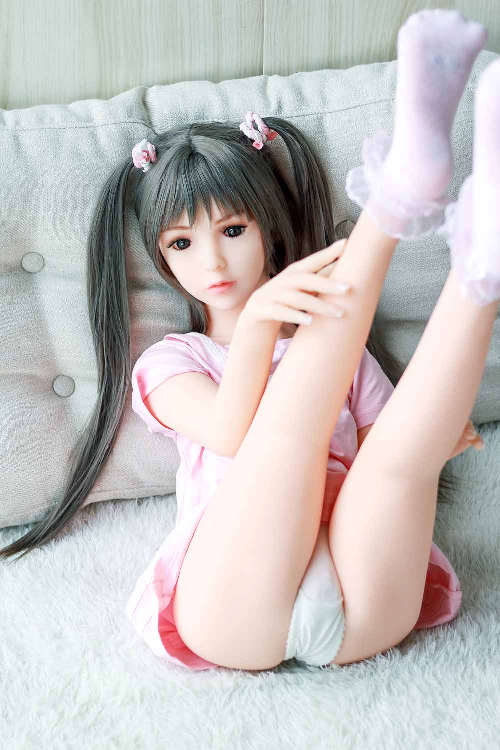 Mini sex doll with legs raised