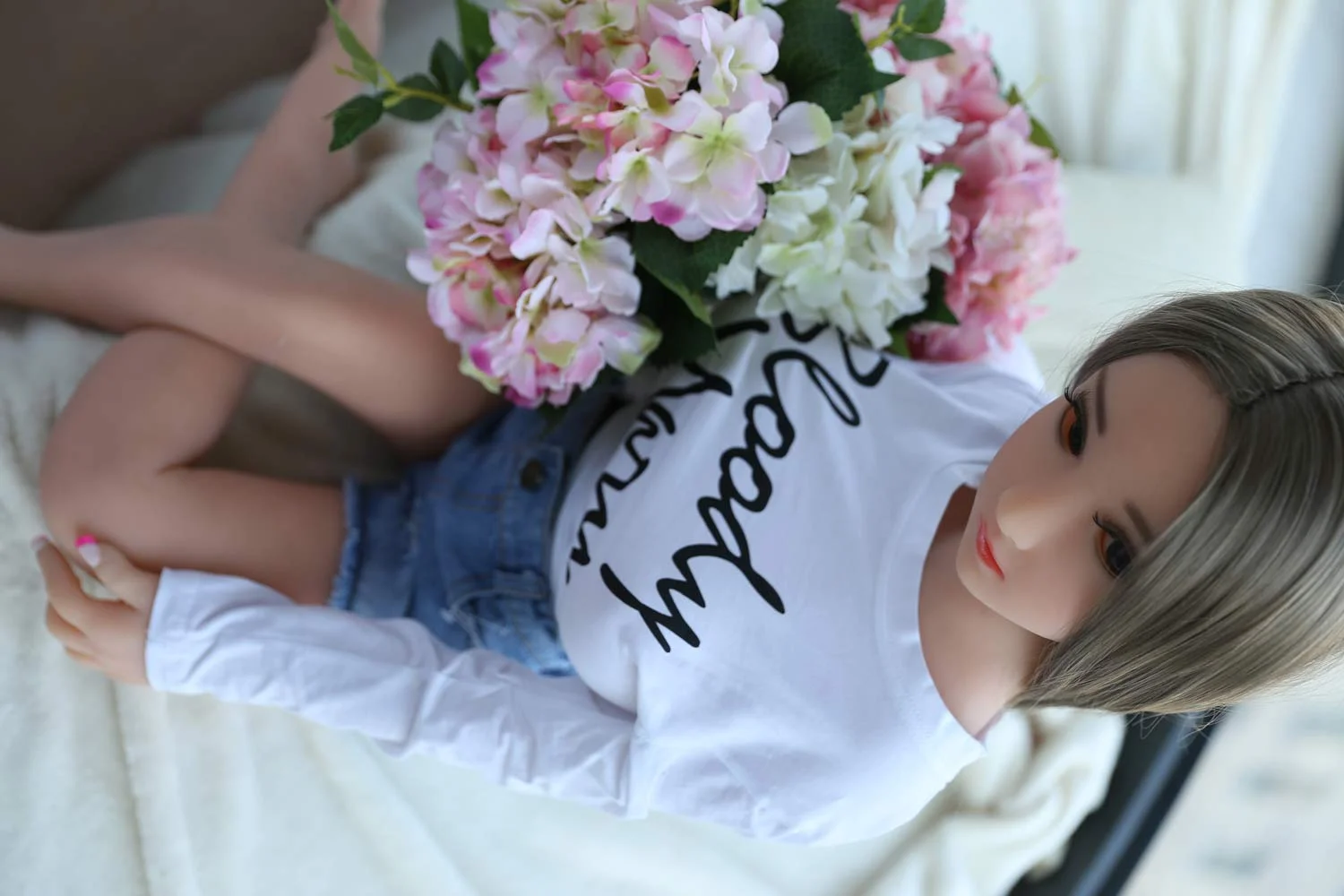 Mini sex doll with red nails
