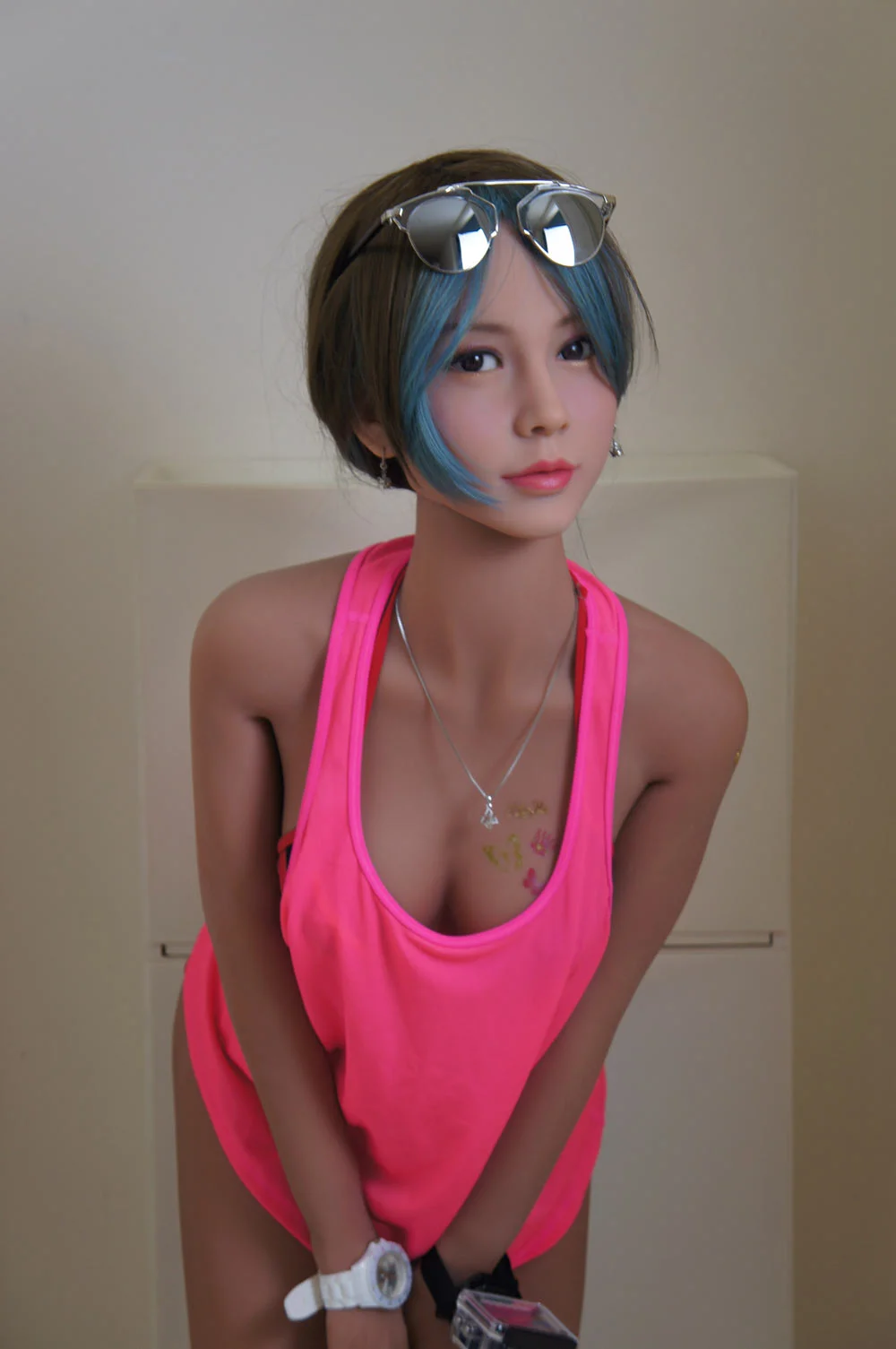 Sex doll wearing a white watch