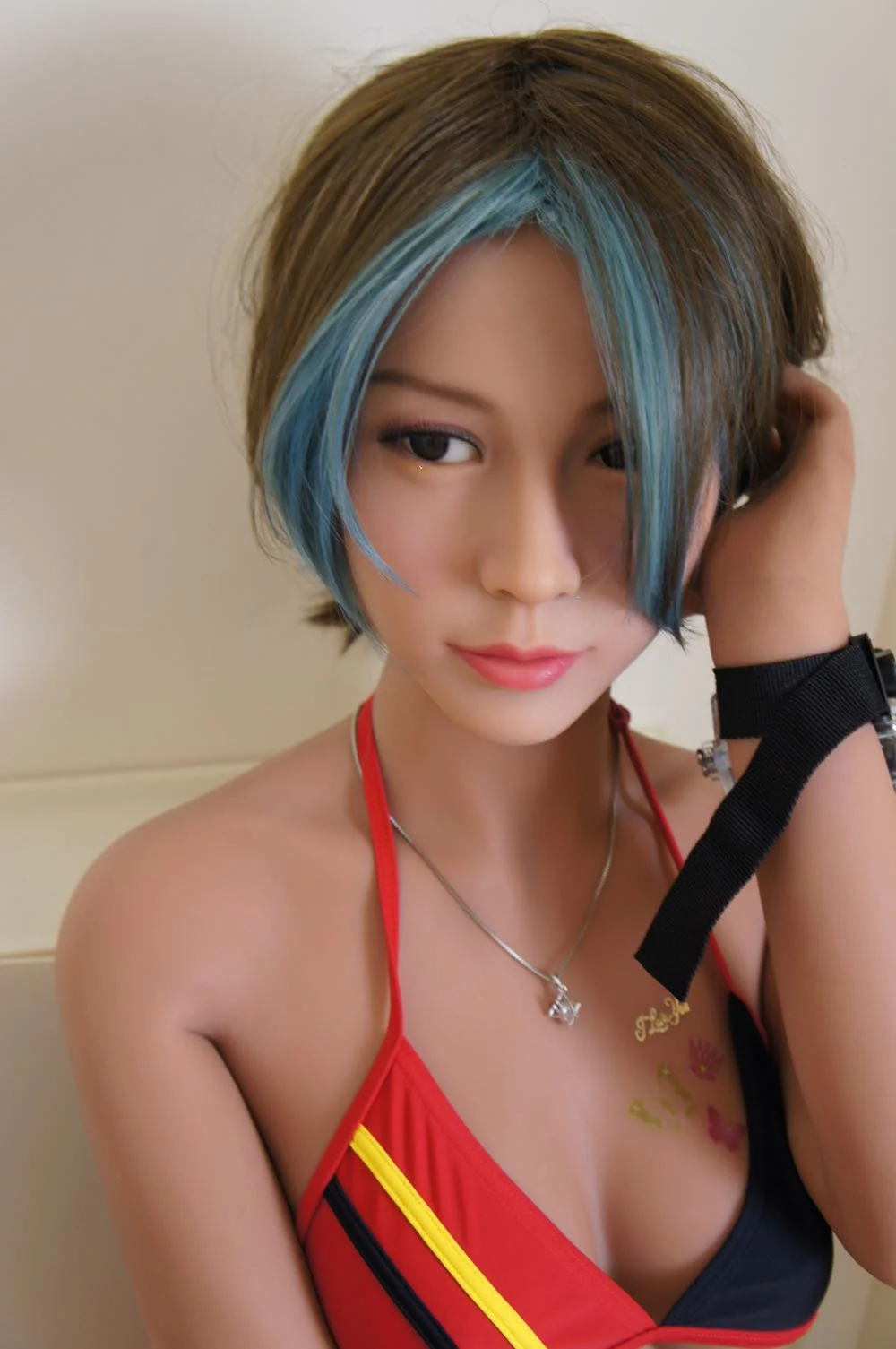 Sex doll with hand touching hair