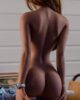 Sex doll with hands on buttocks