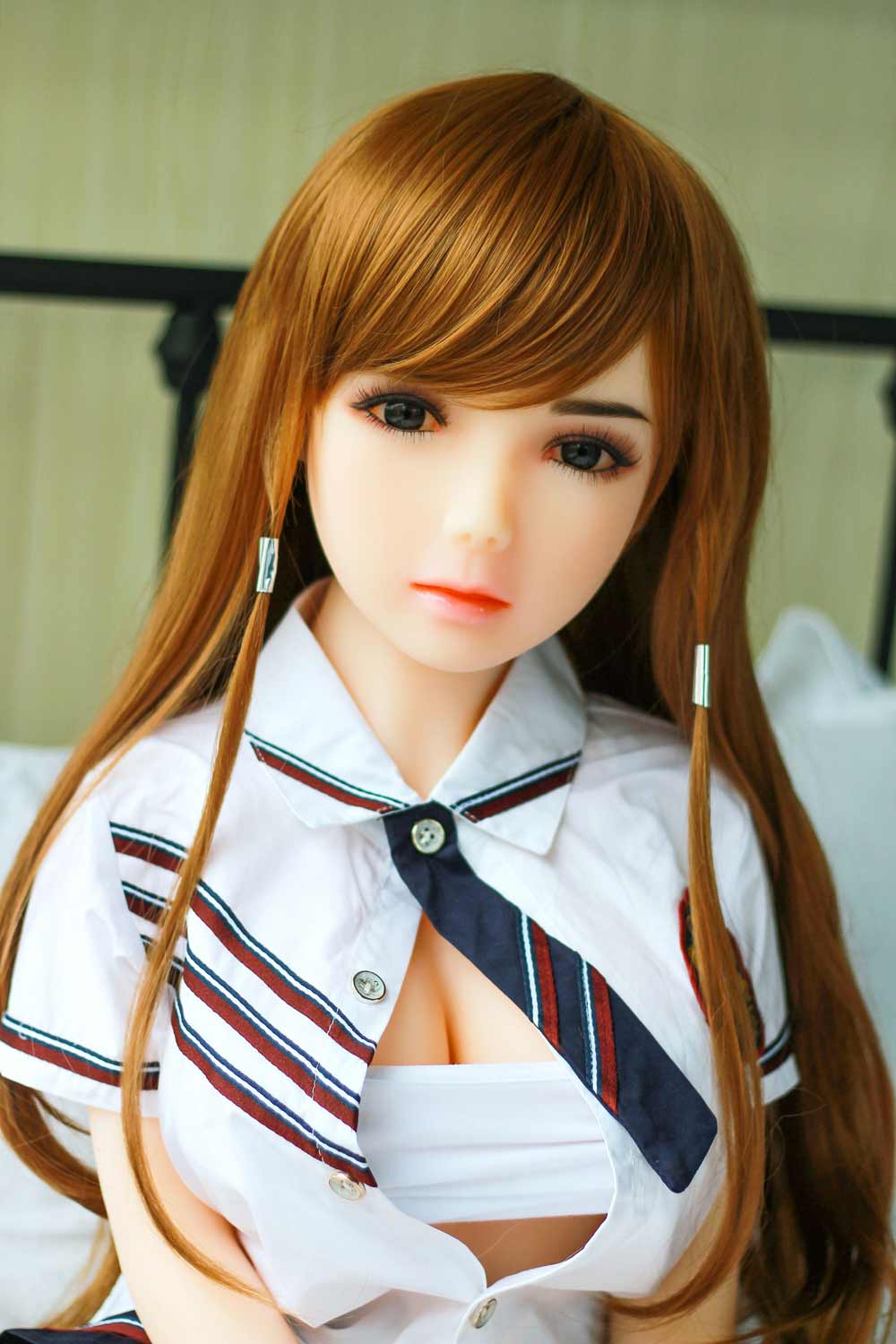 A mini sex doll with unbuttoned clothes and breasts exposed