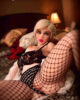 A sex doll with legs raised to expose vagina