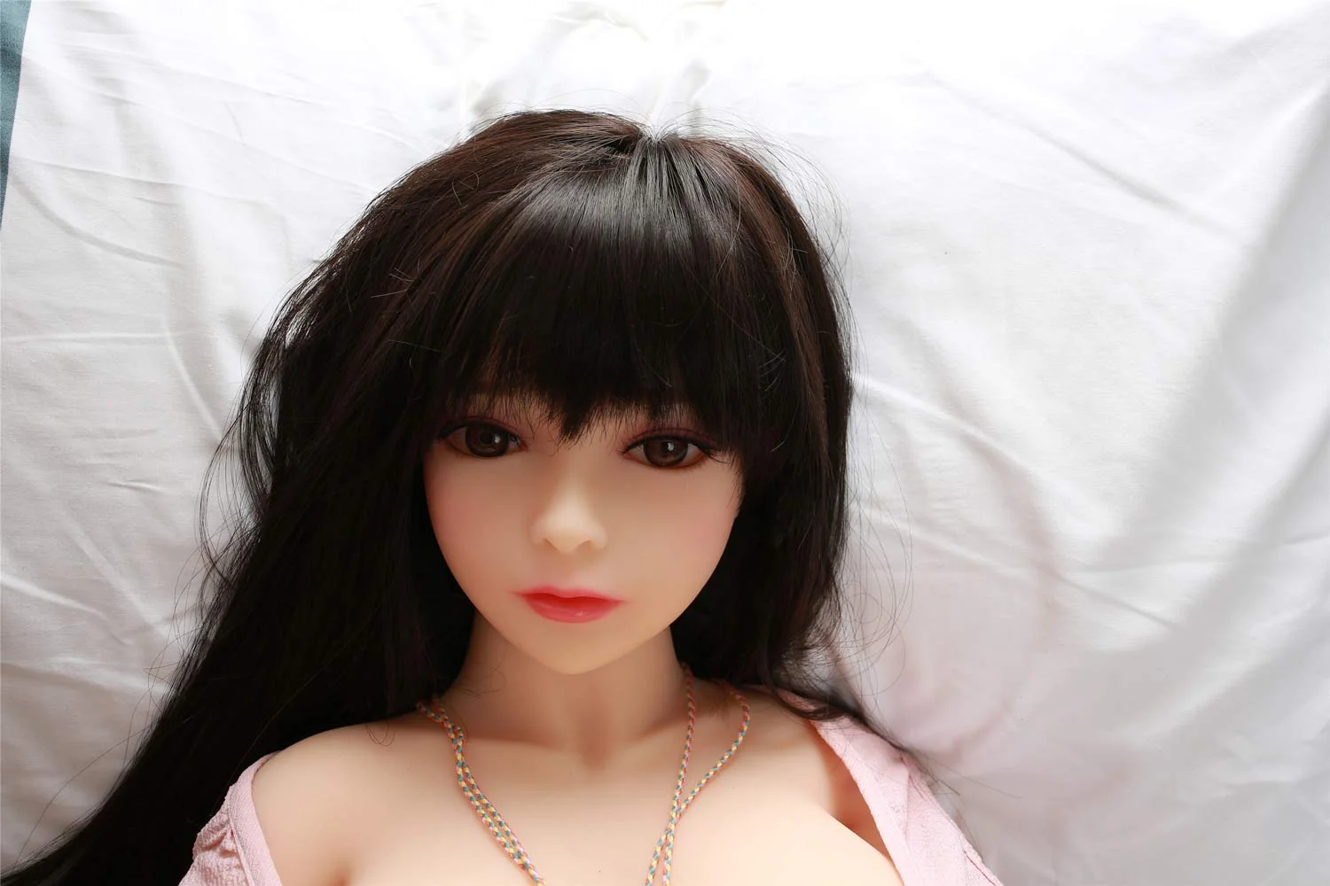 Black haired mini sex doll