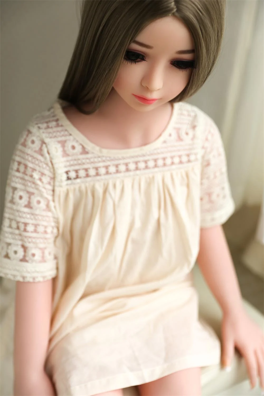Brown haired mini sex doll