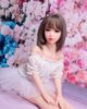 Mini sex doll in white skirt