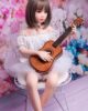 Mini sex doll sitting on a chair