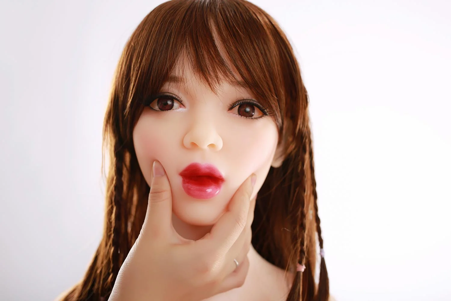 Mini sex doll with chin pinched