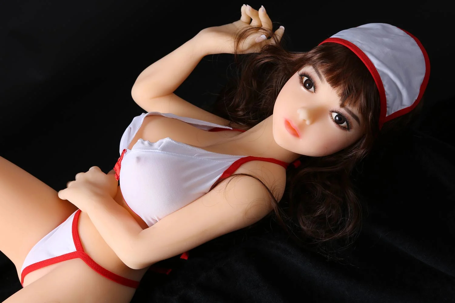 Mini sex doll with hands on belly