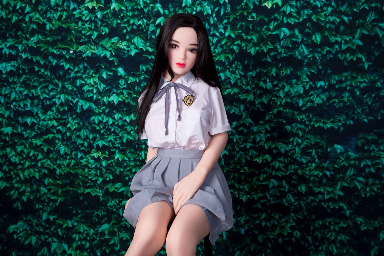 Mini sex doll with hands on skirt