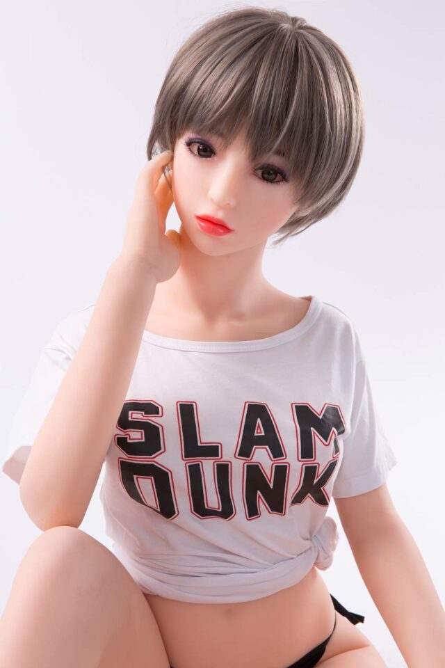 Mini sex doll with hands touching cheeks
