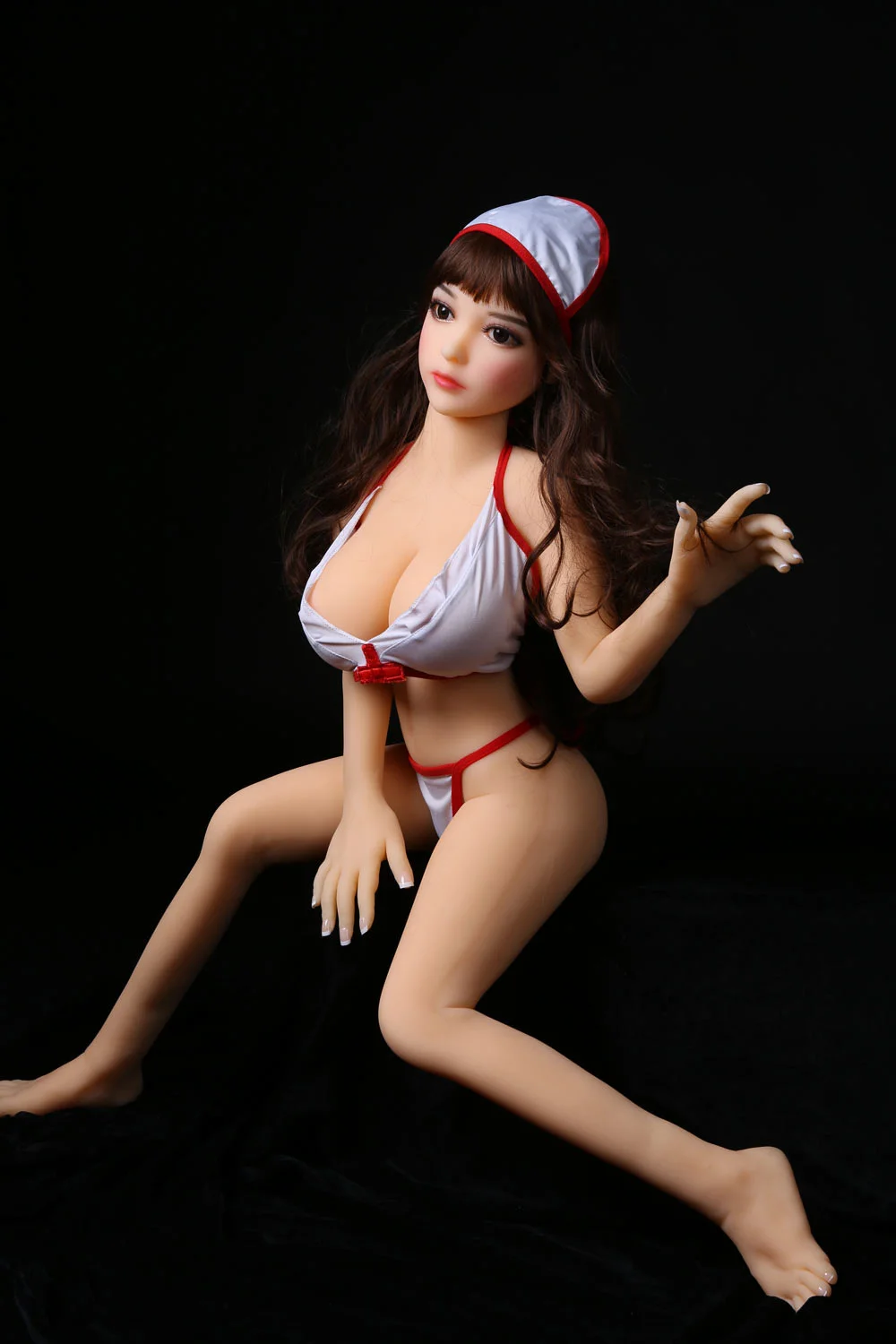 Mini sex doll with one hand raised